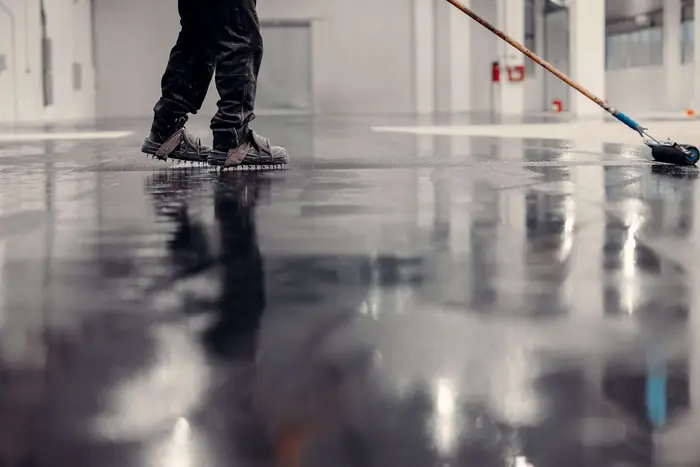 210 Epoxy Pros crew rolling a high-gloss epoxy coat
